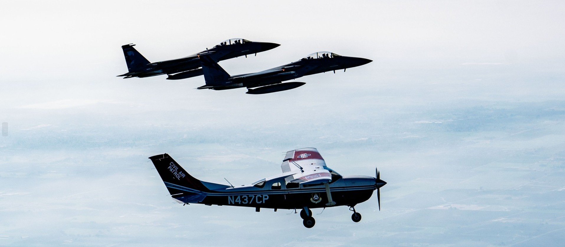 Civil Air Patrol Cessna with F-15 escort
